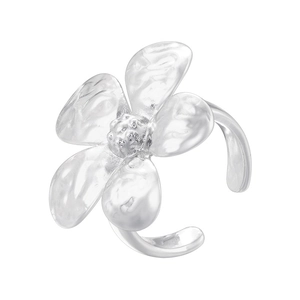 Detail of silver floral ring featuring a three-dimensional flower shape with petal texture