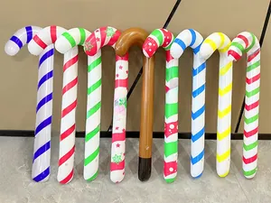 Close-up of inflatable Christmas candy cane balloons with diverse festive stripe patterns