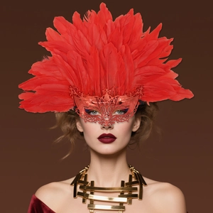 Luxurious red feather Venetian mask with intricate metal filigree for Halloween party