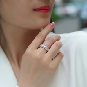 Classic S925 sterling silver moissanite eternity ring worn by model in natural light