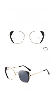 Detail showing black and gold metal square frame glasses with photochromic lenses