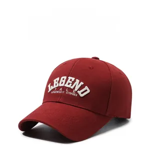 Detailed close-up of dark red baseball cap featuring white 3D LEGEND embroidery