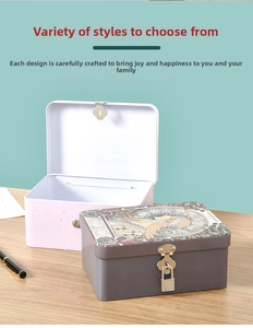 Detail of vintage tin storage box with metal lock mechanism on a wooden surface