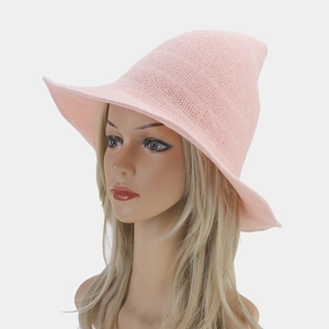 Detail view of the pink knit witch hat featuring a pointed top and wavy brim texture