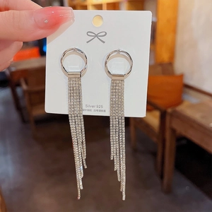 Close-up of long silver tassel earrings with S925 needles and sparkling rhinestones