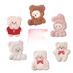 Detail of self-adhesive cartoon bear and rabbit embroidery patches for DIY clothing