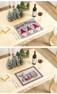 Christmas gnome table placemats with Merry Christmas and JOY text in festive home setting