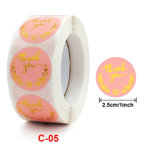 Pink round thank you sticker roll with gold lettering and 2.5cm size dimension label