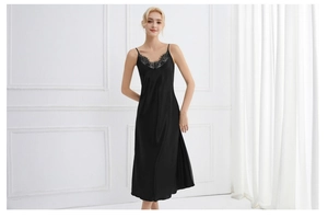Close-up of black satin nightgown featuring elegant V-neckline with delicate lace trim