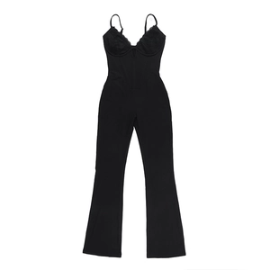 Detailed close-up of black lace patchwork and flared leg design on a sexy jumpsuit