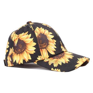 Detail of sunflower print baseball cap with curved brim and premium stitching quality