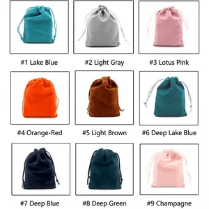 Set of 9 velvet drawstring jewelry pouches in multiple colors with sleek fabric texture