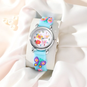 Detail of blue silicone kids watch with 3D butterfly, floral accents and pearl background