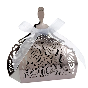 Detail showing laser-cut silver hollow princess dress gift box with white organza ribbon bow