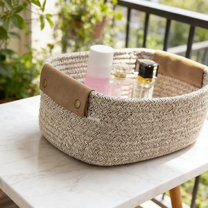 Minimalist cotton rope woven storage basket with premium brown leather handles for home decor