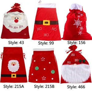 Set of six festive Christmas drawstring velvet gift bags with assorted holiday designs