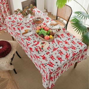 Rectangular linen Christmas tablecloth featuring red Santa Claus prints for festive dining decor