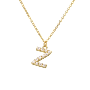 Detail of gold letter Z pendant necklace featuring elegant inlaid white pearls