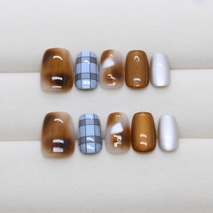 Brown tortoiseshell and blue plaid press-on nails with glossy cat eye finish