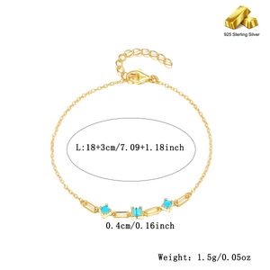 Detailed view of 925 silver gold bracelet with blue turquoise and zircon link details