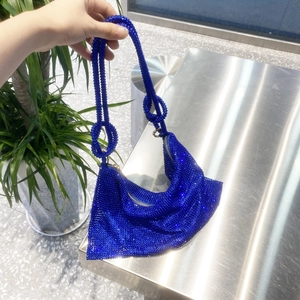 Close-up of Klein Blue rhinestone shoulder bag with beaded handle and zipper detail