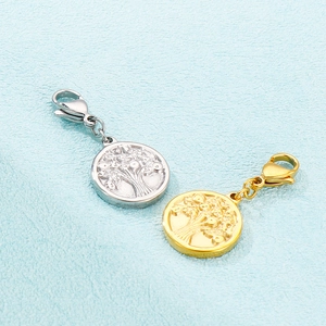 Detailed view of gold and silver tree of life pendants with lobster clasps