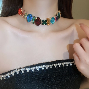 Close-up of a colorful geometric choker necklace featuring vibrant crystal stones