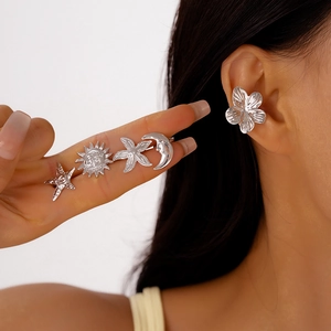 Silver metallic ear cuff set featuring sun moon starfish and flower motifs for women
