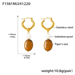 Detail view of tiger's-eye earrings with size dimensions and stainless steel material info