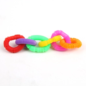 Close-up of interconnected colorful plastic pop tubes in a chain formation for sensory play