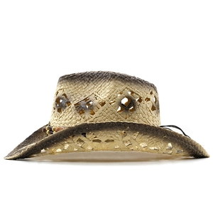 Detail of hollow-out straw cowboy hat with gradient dye and decorative beaded band