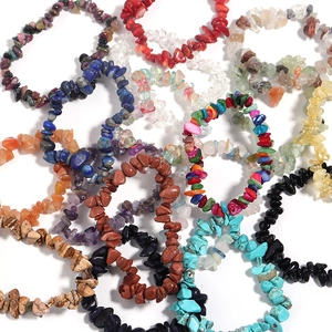 Detailed top view of various natural agate and colorful crystal elastic bracelets stacked