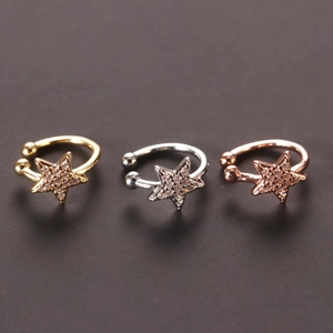 Star-shaped ear cuff set with rhinestones in gold, silver, and rose gold colors