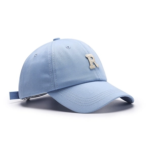 Light blue cotton baseball cap with beige letter R embroidery and curved brim