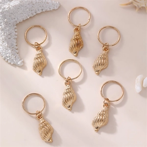 Set of 6 gold conch shell hair charms with rings on sea stars background