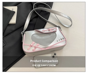 Silver shoulder bag with heart mesh, pink trim and a phone for size reference