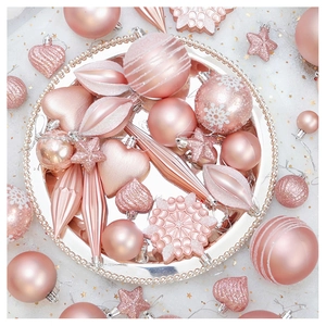 Close-up of pink Christmas ornament set with glitter heart, star and snowflake shapes