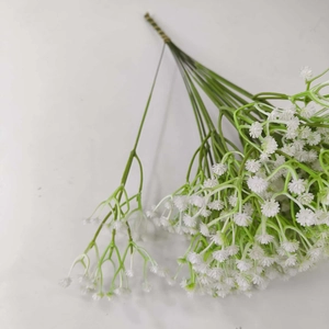 Detailed close-up of realistic white gypsophila artificial flowers for wedding decoration