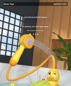 Detail of yellow duck bath toy with electric hand shower and flexible water hose