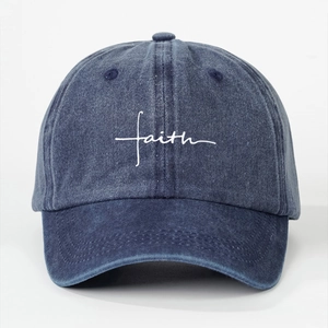 Washed navy cotton baseball cap with white faith cross embroidery on white background