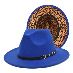 Detail of dark blue fedora hat with leopard print brim lining and black belt with metal buckle