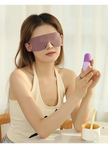 Close-up of soft breathable sleep mask on model with purple capsule storage case