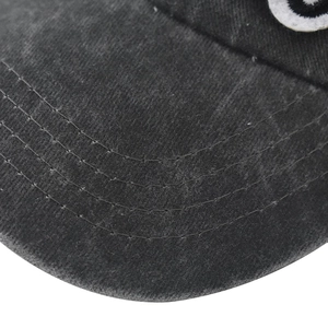 Close-up of the washed dark gray cotton brim with four-row stitching and embroidery details