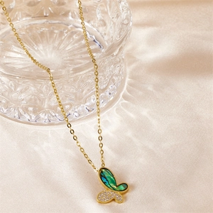 Elegant butterfly pendant necklace with green abalone shell and white zircon on silk fabric