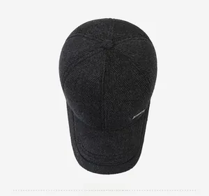 Top view of winter wool baseball cap with herringbone pattern and metal logo detail