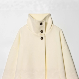 Elegant cream double-sided wool coat with stand collar and textured amber buttons
