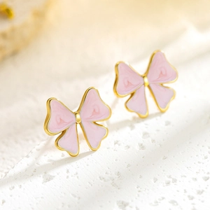 Elegant gold bow earrings with pink marble enamel texture for a stylish minimalist look