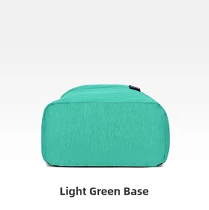 Detailed view of the reinforced light green bottom panel and BOYU woven logo on the backpack