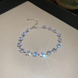 Detailed view of silver heart-shaped crystal bracelet with adjustable extension chain