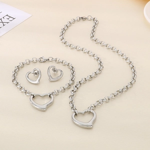 Polished stainless steel jewelry set with hollow heart necklace, bracelet, and earrings